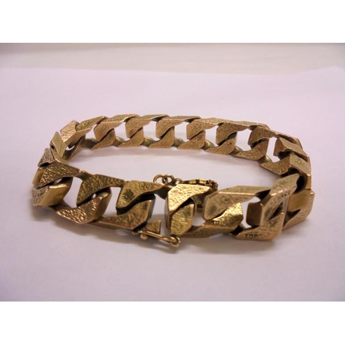 205 - 9ct Gold Gents Bracelet with safety chain, bark effect links, each linked marked