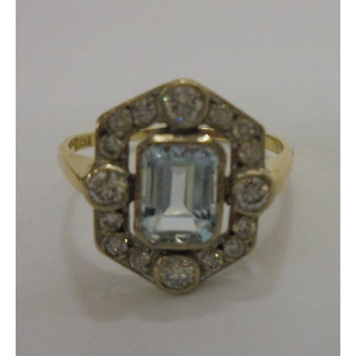 216 - 18ct Yellow Gold Ladies Ring set aquamarine with diamond surround, size R