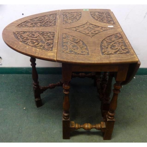 26 - Unusual Carved Oak Gate Leg Table, top carved with strapwork & scrolls on baluster turned supports w... 