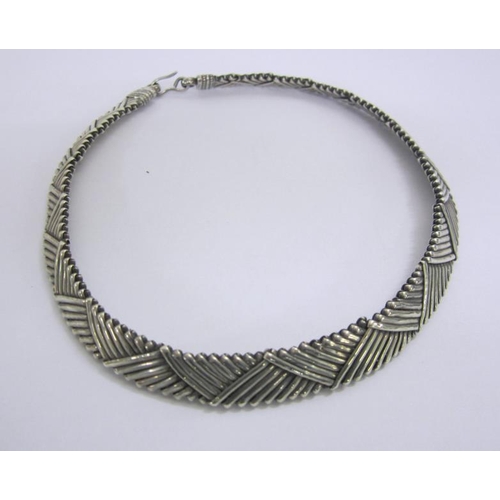 432 - Unmarked White Metal Torque Style Necklace with geometric, triangular reeded decoration