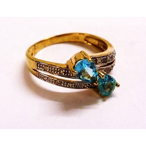 450 - 9ct Gold Split Shank Tear Drop Shaped Blue Topaz Ring with diamond set shoulders, size P