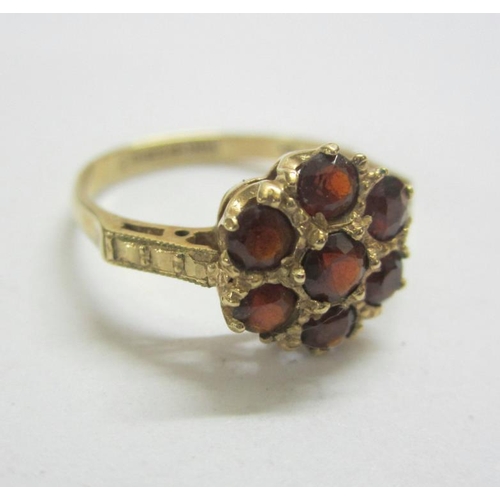 509 - 9ct. Gold Garnet Floral Cluster Ring, Size M 1/2