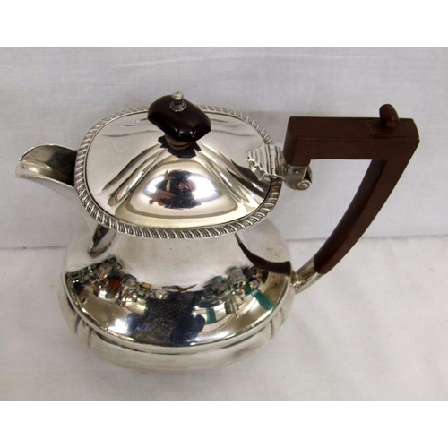 246 - Silver Hot Water Jug on 4 ball supports with composition handle & finial, Birmingham 1936