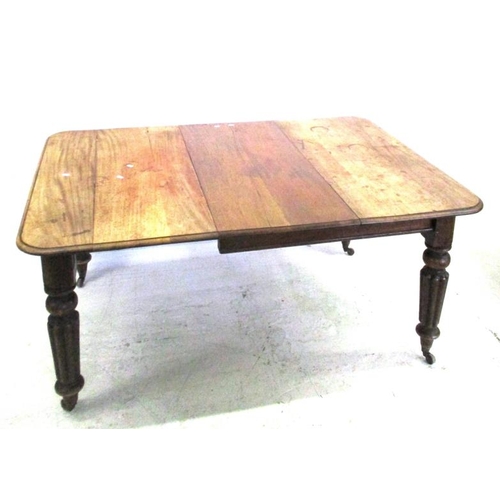 87 - Victorian Mahogany Extending Dining Table with single leaf, on reeded supports with brass & ceramic ... 