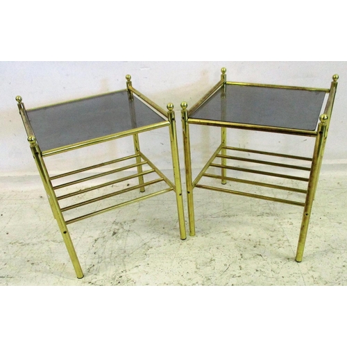 102 - Pair Lacquered Brass Lamp Tables with magazine racks under, on tubular supports with smoked glass to... 