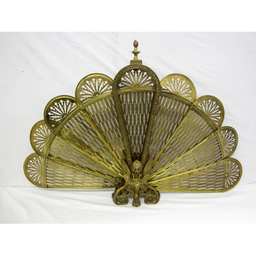 71 - Brass Peacock Fire Screen with pierced filaments in winged griffin stand