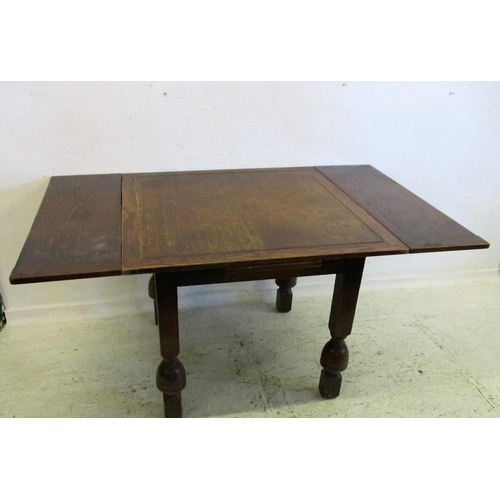 56 - Mid Oak Draw Leaf Table on square bulbous supports