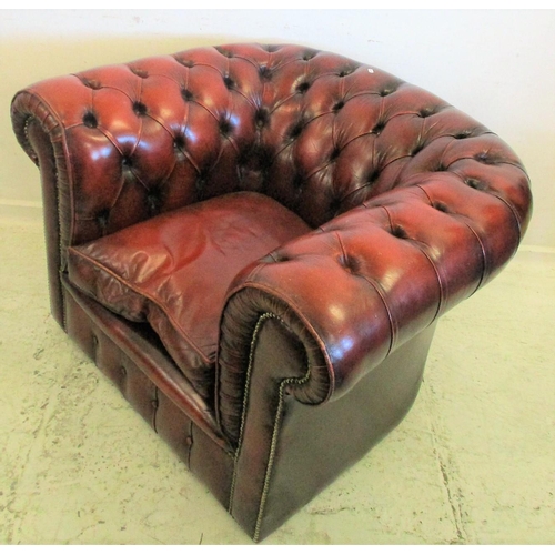 118 - Maroon Leather Chesterfield Armchair with squab seat, deep buttoned back & arms