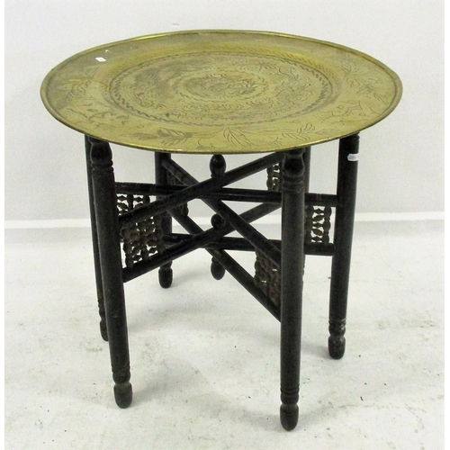 19 - Circular Brass Eastern Tray on ebonised folding stand with 6 turned supports