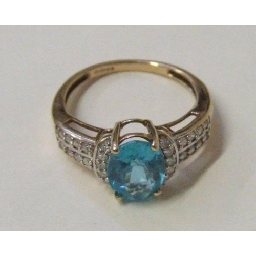 506 - 9ct. Gold Blue Topaz & Diamond Ring, central stone approx. 90mm Long, with 5 cresecent set diamonds ... 