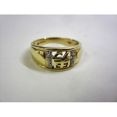 218 - 9ct. Gold Gents Ring with Pierced Oriental Script & Diamond Inset Shoulders, size Y