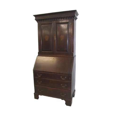 53 - C18th Oak Bureau with fall enclosing well fitted interior of small drawers & divisions, central door... 