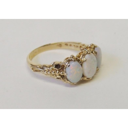 230 - 9ct. Gold Opal Trilogy Ring, 3 oval opals in decorative setting, size O