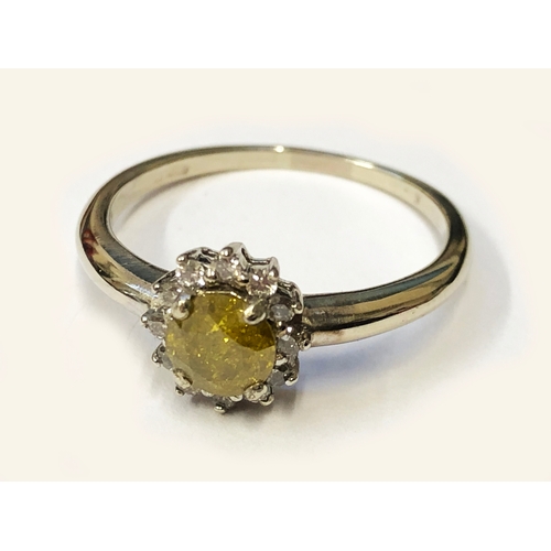 215 - 18ct. White Gold Floral Cluster Ring set central Yellow Diamond with White Diamond Surround, size M