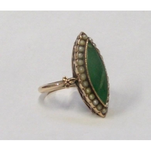 206 - Marquise Shaped Green Stone Set Ring surrounded by seed pearls held in yellow metal shank, size E