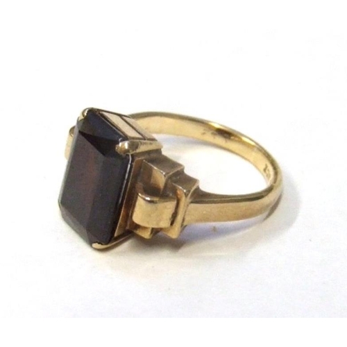 208 - 9ct. Gold Art Deco Style Ring with staged central set trap cut garnet, marked PPI D, size F 1/2