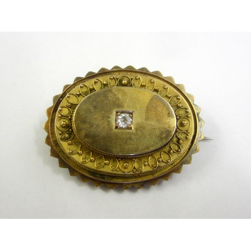 231 - Yellow Metal Oval Victorian Brooch Set Diamond with locket back, steel pin