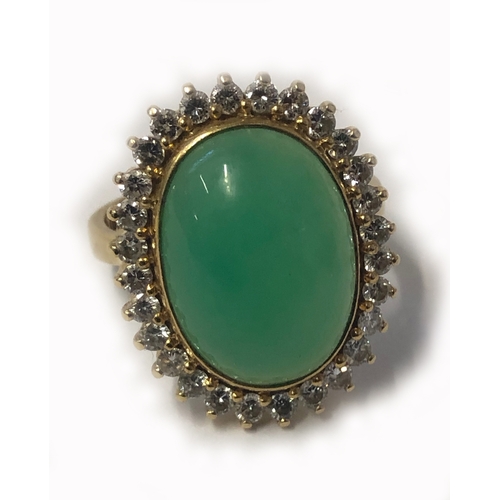 243 - Ladies 18ct Gold Jade & Diamond Ring with oval cabochon surrounded by 28 brilliant cut round diamond... 