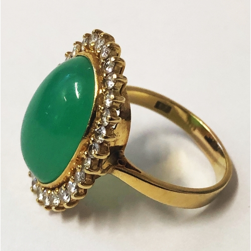 243 - Ladies 18ct Gold Jade & Diamond Ring with oval cabochon surrounded by 28 brilliant cut round diamond... 