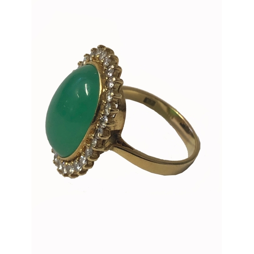 243 - Ladies 18ct Gold Jade & Diamond Ring with oval cabochon surrounded by 28 brilliant cut round diamond... 