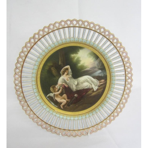 338 - C19th Vienna Porcelain Ribbon Plate decorated with Cupid holding sprig of leaves, quiver at his feet... 