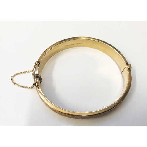 249 - 9ct Gold Half Hinged Bangle, textured finish, safety chain