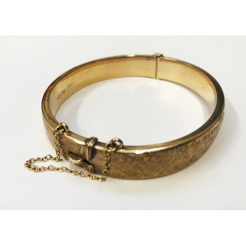 249 - 9ct Gold Half Hinged Bangle, textured finish, safety chain