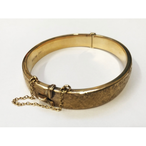 249 - 9ct Gold Half Hinged Bangle, textured finish, safety chain