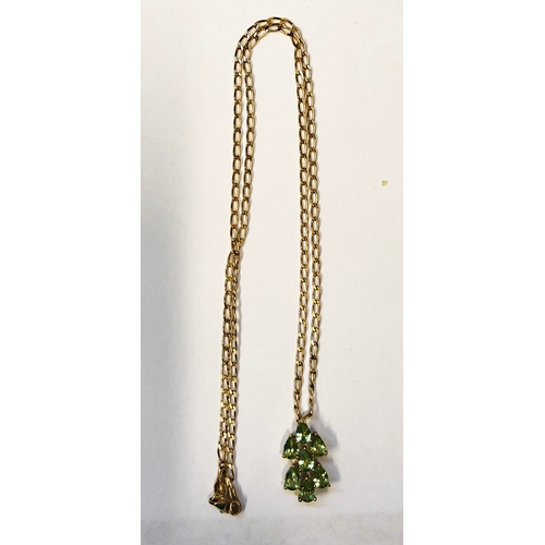 245 - 9ct. Gold 7 Stone Peridot Cluster Pendant on chain/Necklace