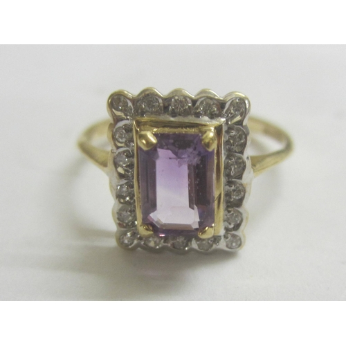 344 - Amethyst & Diamond Ring set 9ct. Gold with rectangular amethyst surrounded by diamonds, size J 1/2