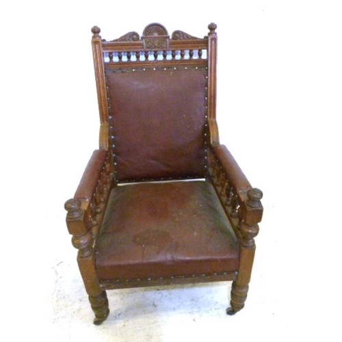 32 - Oak Framed Victorian Gents Armchair with galleried arm supports, scrolling leaf carvings, overstuffe... 