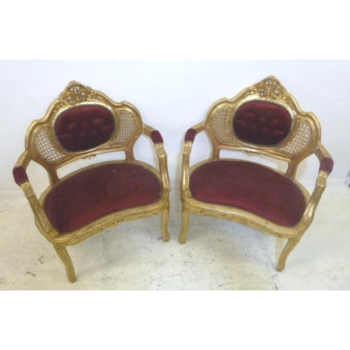 99 - Pair Continental Gilt Open Armchairs with kidney shaped seats, rattan & deep buttoned backs, on cabr... 