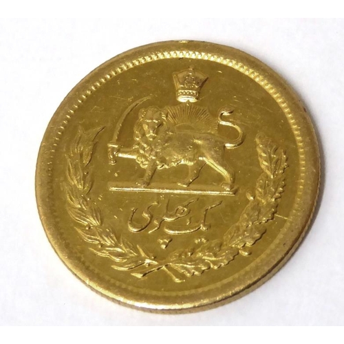 578 - Iranian Gold Coin with Arabic script, reverse with lion holding sword under crown with wreath, appro... 