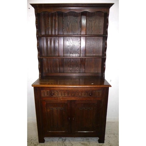 19 - Oak Dresser with 2 linen fold doors, scoop carved frieze drawer, shelf over under canopy with cornic... 