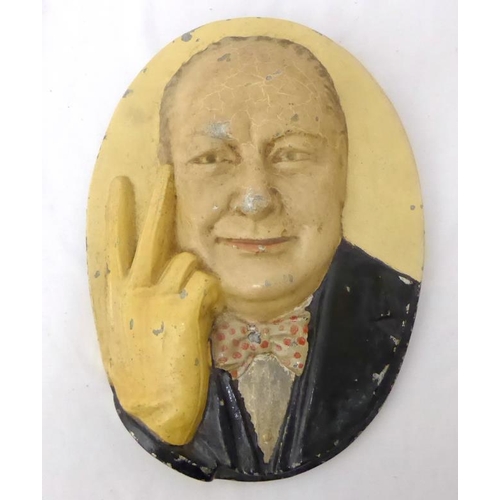 1639 - Oval Heavy Metal Plaque of Winston Churchill with painted finish, approx. 11