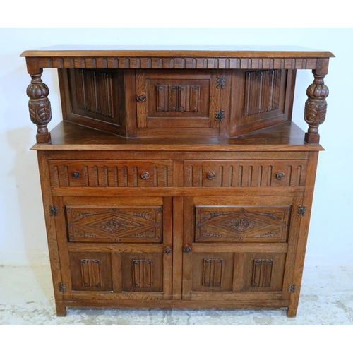 30 - Reproduction Oak Duodarn, lower section with 2 linenfold half panelled doors, 2 scoop carved drawers... 