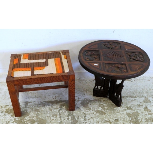 78 - Carved Circular Table with natives round cooking pots on folding 3 sectioned base supported by eleph... 