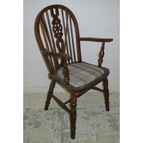 68 - Elm Seated Wheel Back Carver Chair with additional upholstered seat pad, turned supports with stretc... 