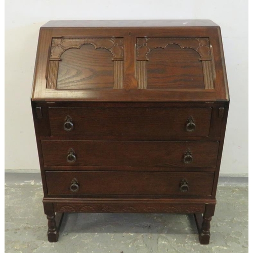 44 - Oak Bureau with carved frieze to base, 2 carved panel to top, 2 long drawers & shorter drawer under,... 