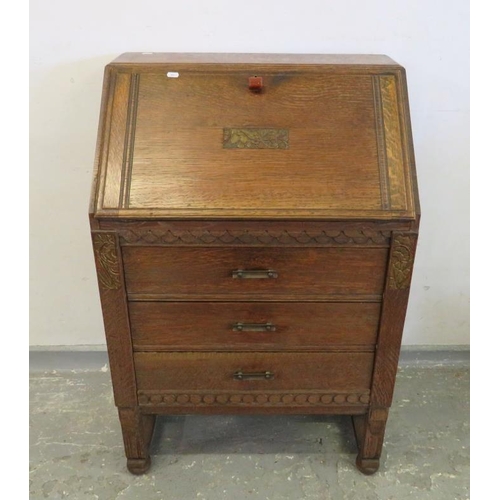 89 - Small Oak Bureau, fall with carved decoration enclosing fitted nest over 3 long drawers (A5)