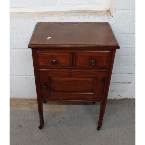 30 - Side Cabinet with frieze drawer, panelled cupboard under, right hand hinged on turned supports with ... 