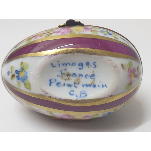 23 - Limoges Egg Signed Peint Main CB to base with floral clasp, puce & floral striped decoration approx.... 