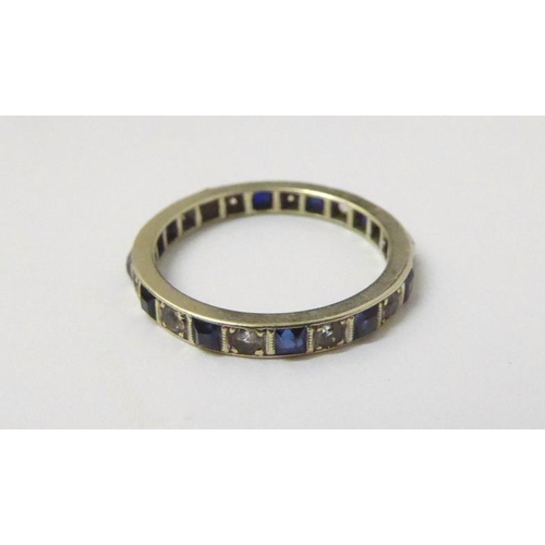 31 - Yellow Metal Eternity Ring set blue & white stones size O