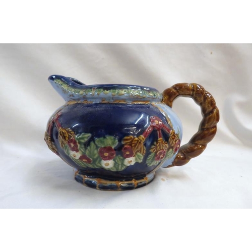 494 - Large Majolica Squat Jug impressed marks to base, pale & royal blue with flowerhead & leaves