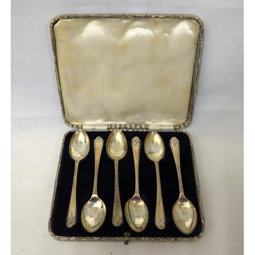 653 - Set 6 Silver Teaspoons in fitted case with crossed golf club and ball decorated finials