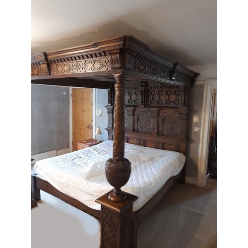 9 - Fine Quality Large Reproduction Oak Four Poster Bed, elaborate carved canopy supported with elaborat... 