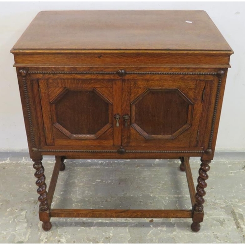 64 - Oak Gramophone Cabinet (empty), on short barley twist turned supports, pair doors to front, hinged l... 