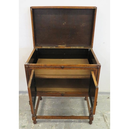 64 - Oak Gramophone Cabinet (empty), on short barley twist turned supports, pair doors to front, hinged l... 