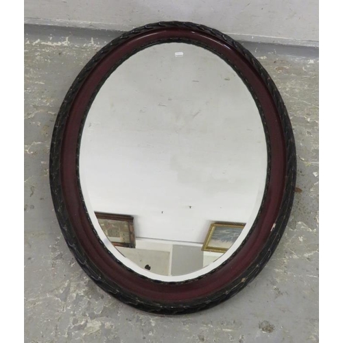 42 - Large Oval Bevelled Glass Wall Mirror, faux wood frame, leaf moulded borders approx. 87cm x 62cm FWR