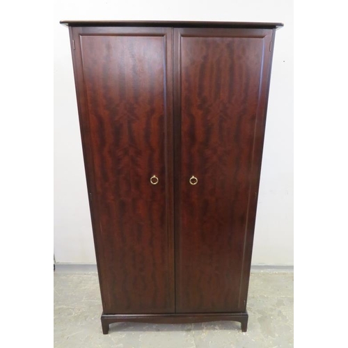 44 - 2 Door Stag Mahogany Wardrobe with gilt ring pull handles, slender bracket supports A14